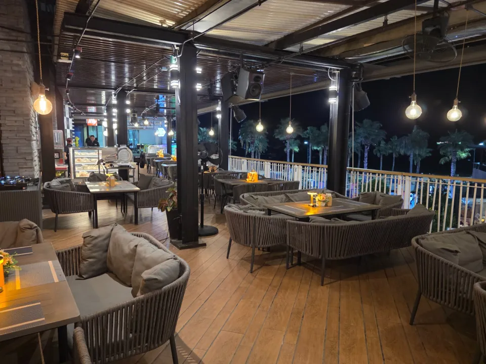 Lounge restaurant seating at Terrazza Baia with bay-facing terrace